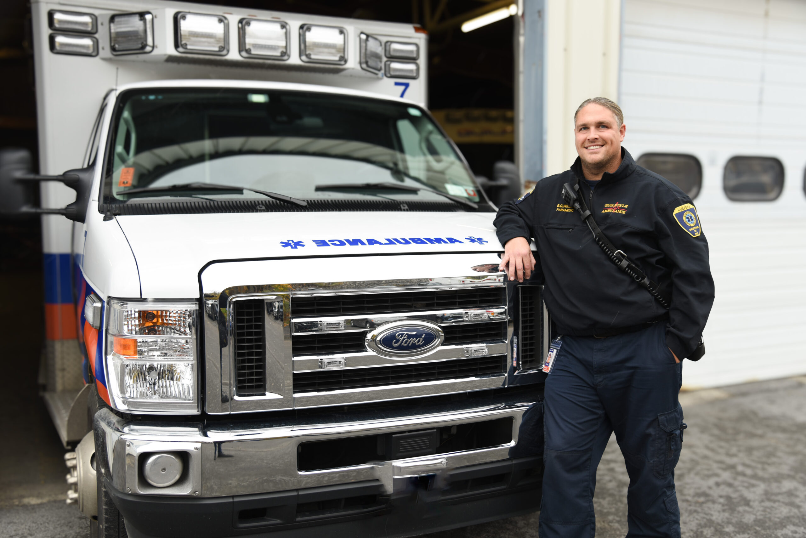 paramedic standing next to ambulance